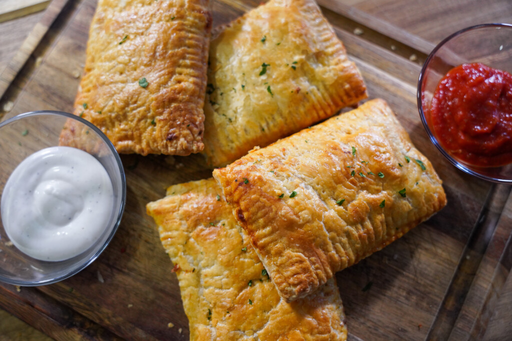 Easy venison pepperoni pizza pockets filled with ground venison, mozzarella cheese, pepperoni and pizza sauce in flaky puff pastry