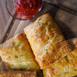 Easy venison pepperoni pizza pockets filled with ground venison, mozzarella cheese, pepperoni and pizza sauce in flaky puff pastry
