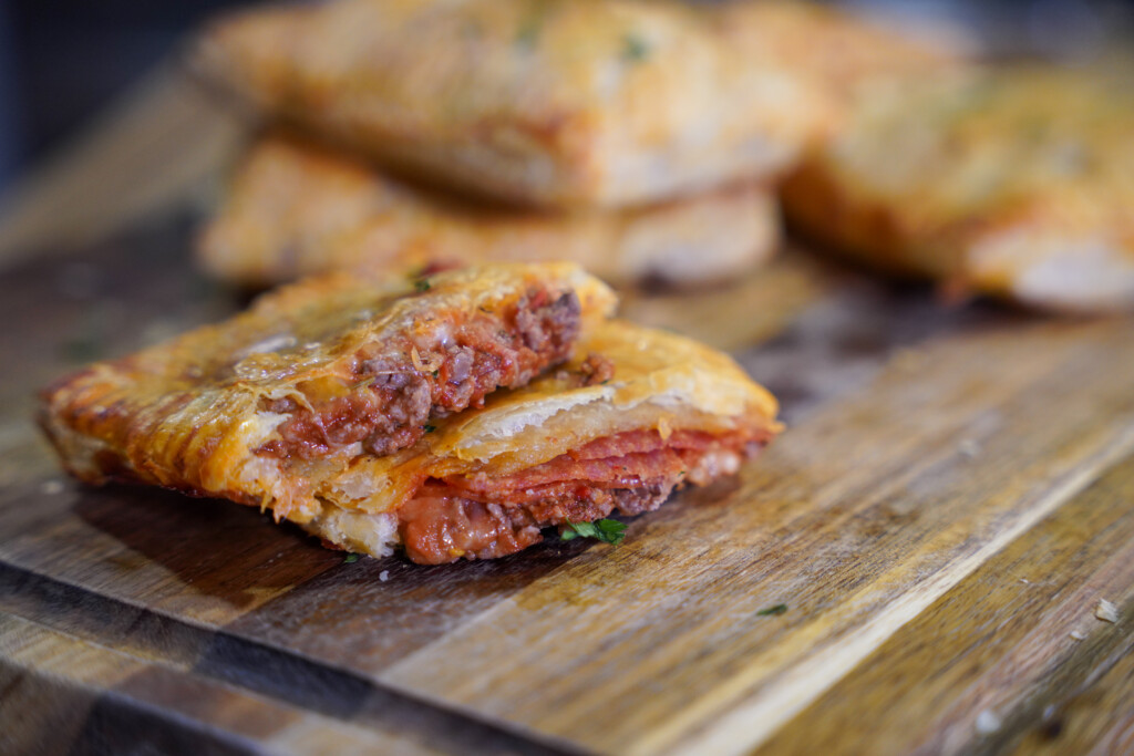 Easy venison pepperoni pizza pockets filled with ground venison, mozzarella cheese, pepperoni and pizza sauce in flaky puff pastry